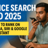 Indian man using voice search on smartphone at desk
